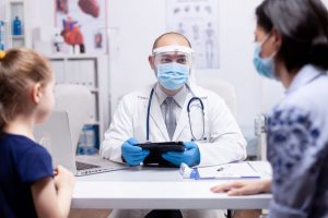 doctor with face mask on talking with patients